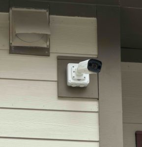LVT-installed security camera on the side of a Community Housing Partners building. 